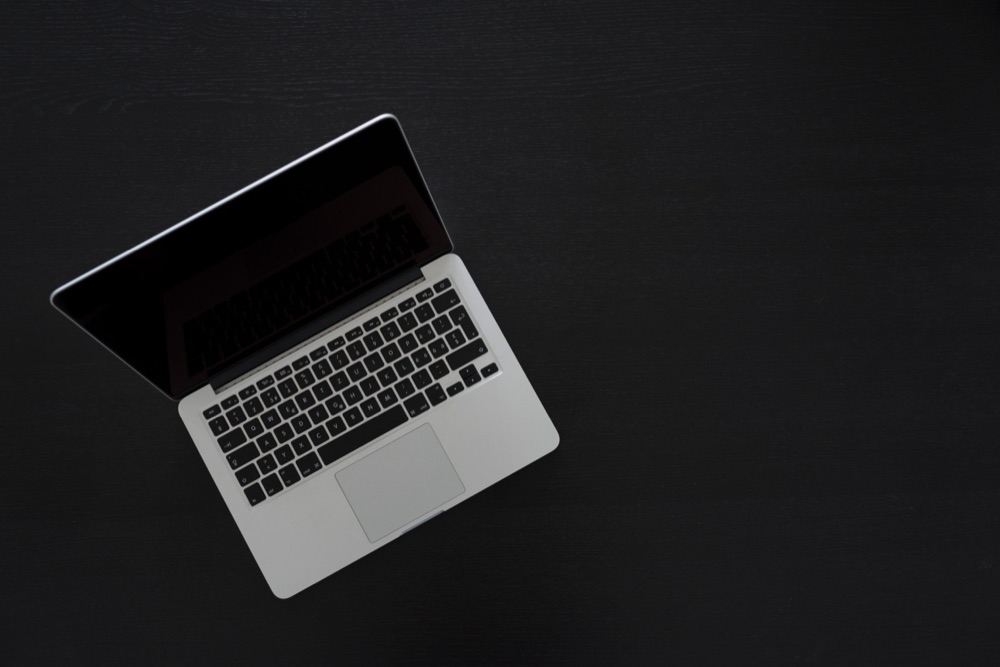 A laptop on a dark desk — where Zaasmi keeps your custom skills stored locally